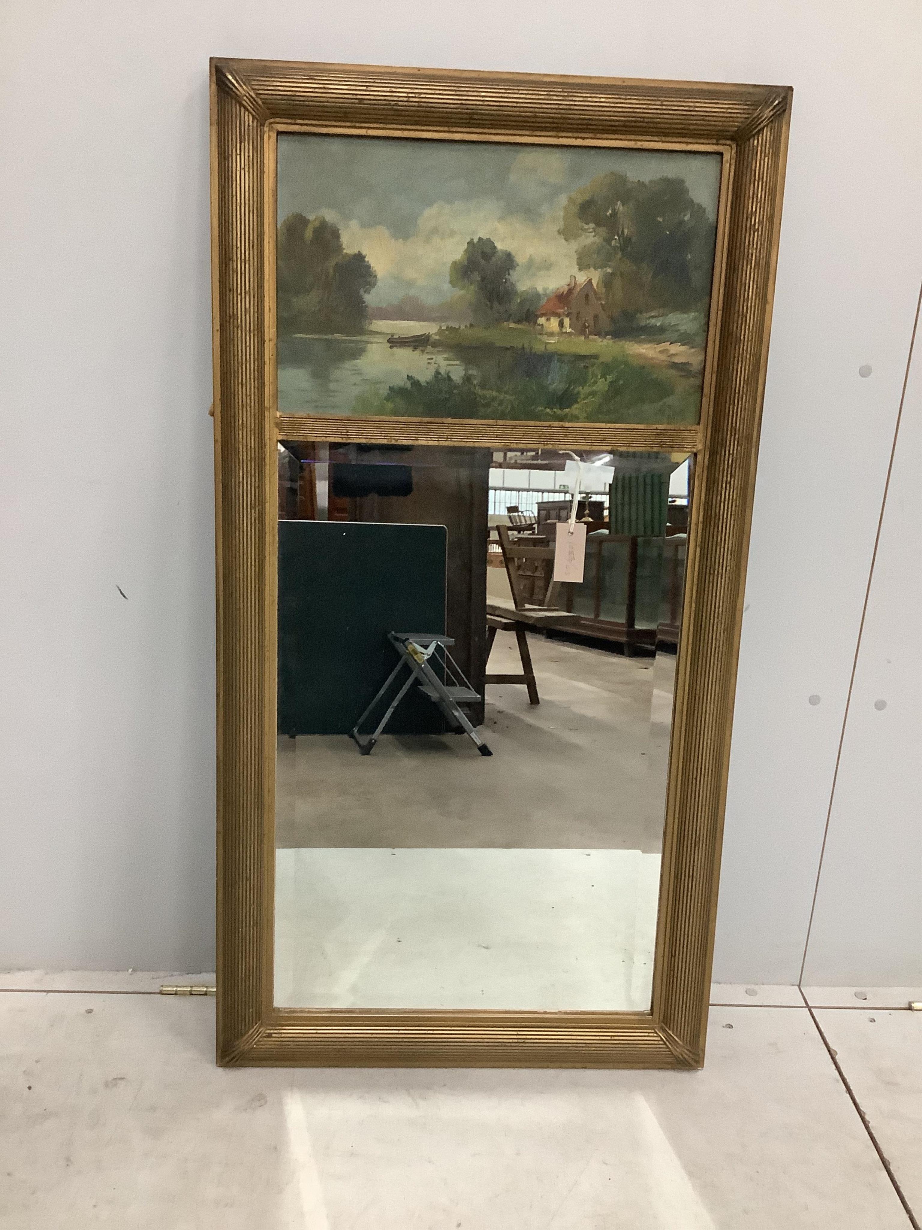 A Victorian style gilt framed trumeau wall mirror, with painted lake landscape, width 64cm, height 122cm. Condition - fair